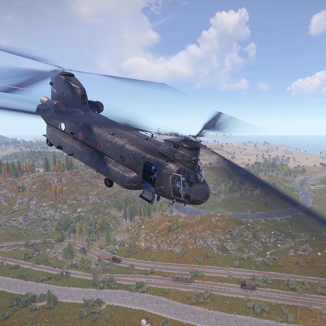 An example of a Chinook flying over the landscape in Rust. The Chinook is a heavy-lift helicopter that delivers supplies or manpower to The Island every hour or so.